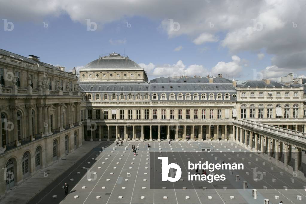 Daniel Buren's columns in the Royal Palace Gardens seen from the Ministry of Culture, rue de Valois in Paris. The columns that grid the court were added in 1986 following a public order from the Ministry of Culture. Photography 19/04/05.