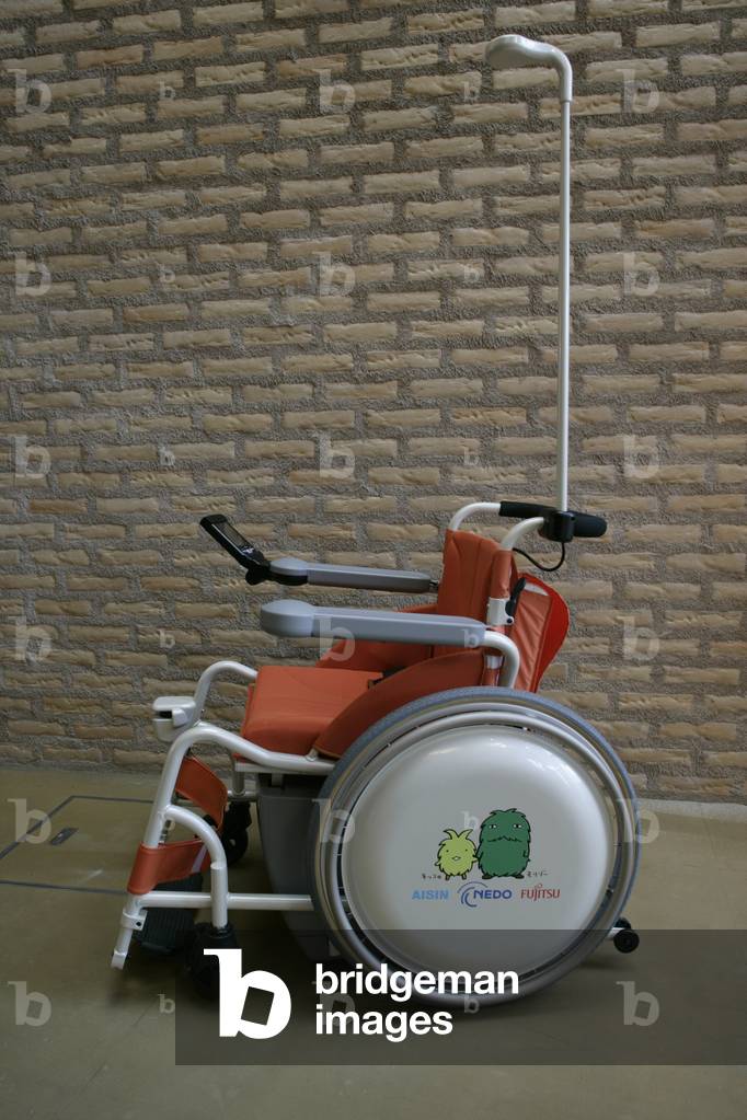 Robot for people has reduced mobility within the Mitsubishi Pavilion at the Aichi World Expo in Japan, 2005.