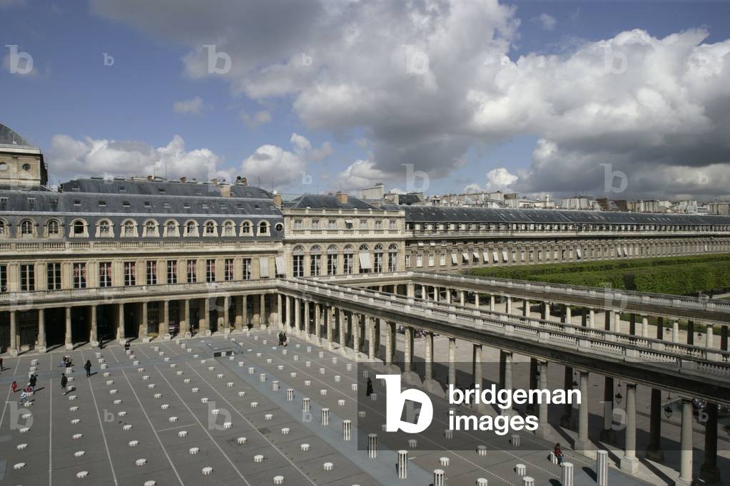 Daniel Buren's columns in the Royal Palace Gardens seen from the Ministry of Culture, rue de Valois in Paris. The columns that grid the court were added in 1986 following a public order from the Ministry of Culture. Photography 19/04/05.