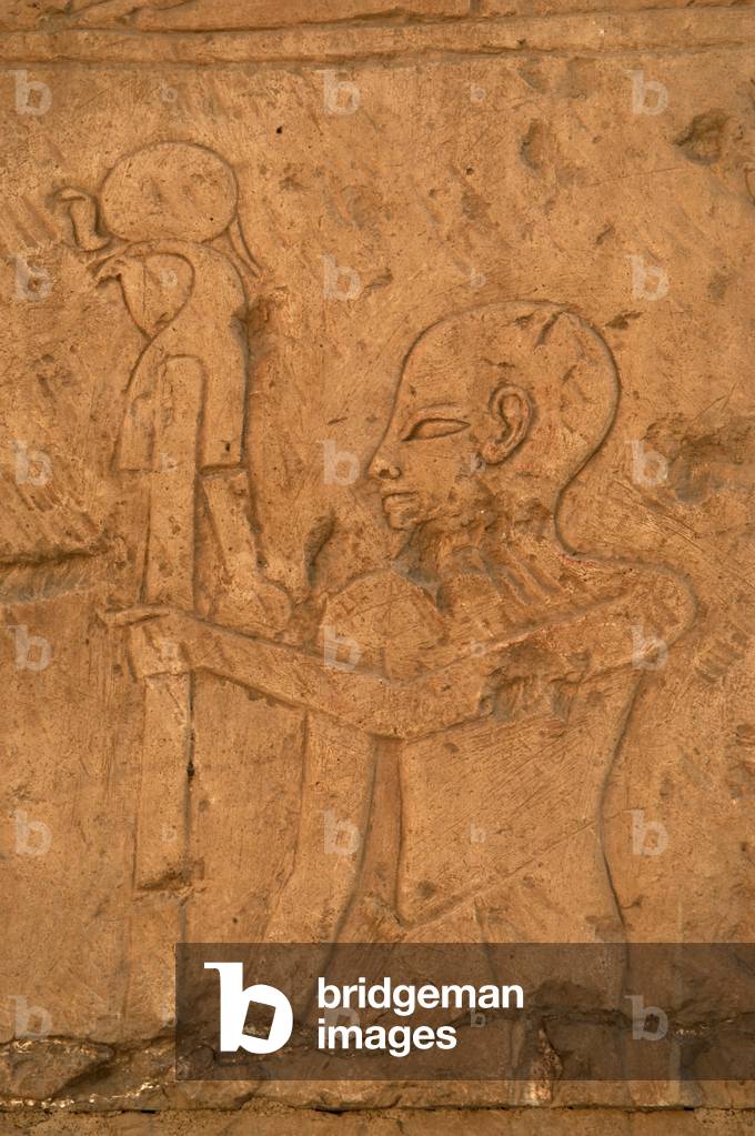 EGYPTIAN ART. Relief depicting a priest carrying the image of the god Ra.