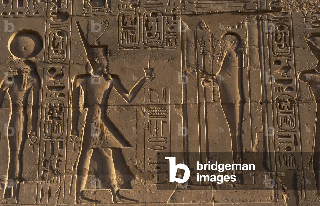 Egyptian Art. Karnak. The Pharaoh Ramesses II making an offering to the god Ptah. Relief.