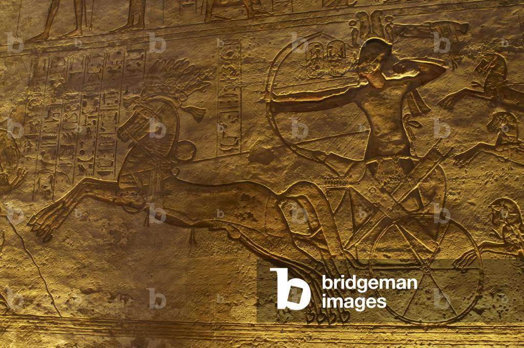 Egyptian art. Great Temple of Ramses II. Military campaign against the Hittites. Ramses II in a chariot with a bow and arrow at the Battle of Kadesh. Abu Simbel. Egypt.