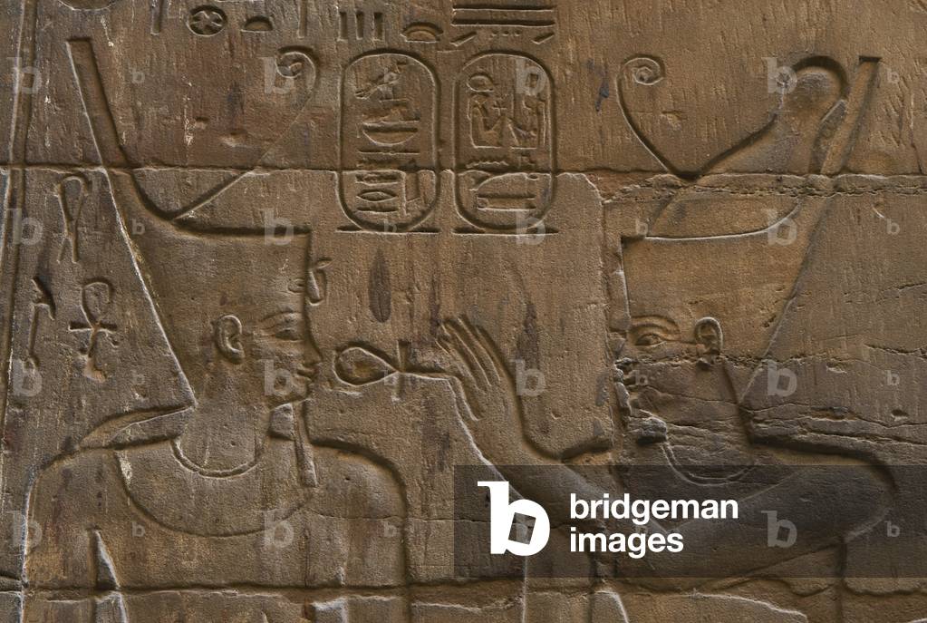 Relief depicting Egyptian divinity giving the Ankh to a pharaoh.