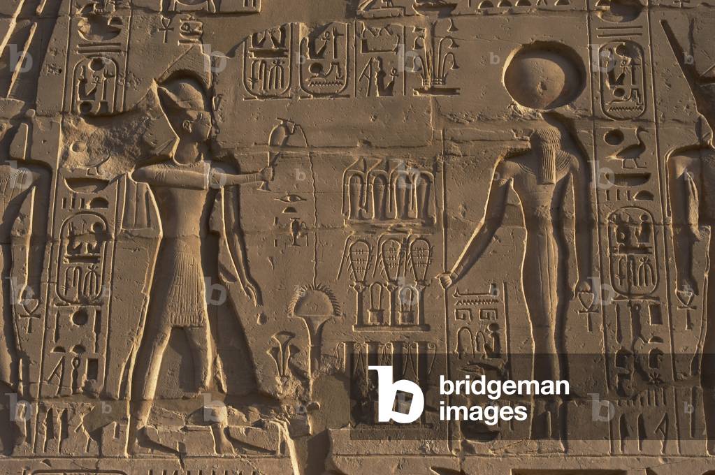 Egyptian Art. Karnak. The Pharaoh Ramesses II making libations to a god. Relief.