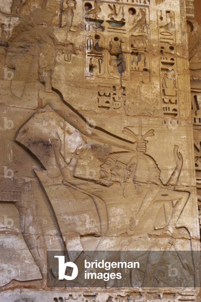 Temple of Ramses III. The pharaoh Ramses III victorious with war prisoners. Egypt.