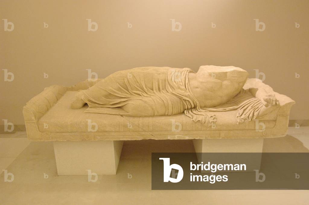 Statue of a reclining man. Greece.