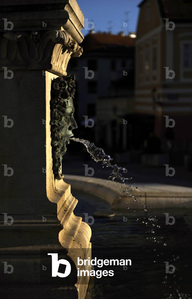 Croatia. Zagreb. Holy Mary's column with angels and fountain. Pipe fountain. Detail. Kaptol Square.
