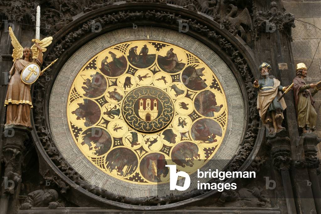 The Prague Astronomical Clock or Prague Orloj mounted on the southern wall of Old Town City Hall in the Old Town Square.The calendar, added to the clock in 1870. The twelve medallions represent the twelve months of the year made by Czech painter Josef Manes (1820-1871). Czech Republic.