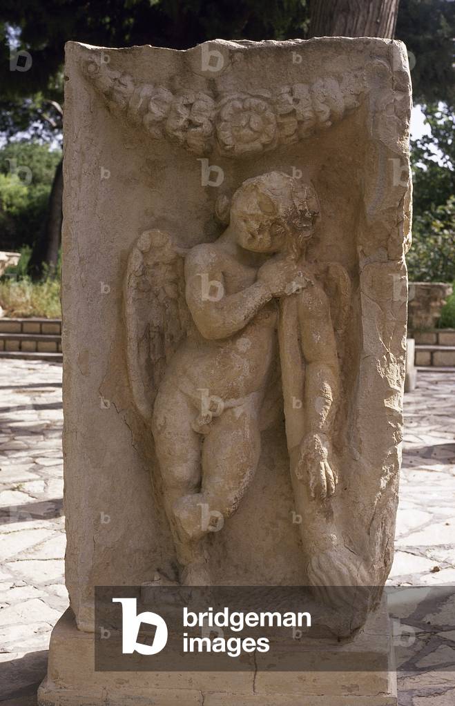 Relief of Cupid with torch burning passion. Roman Art. Maktar. Tunisia.
