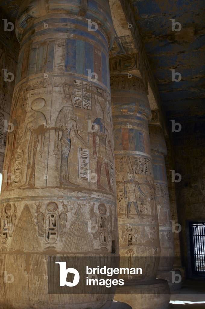 Temple of Ramses III. Columns decorated with polychromed reliefs. Egypt.
