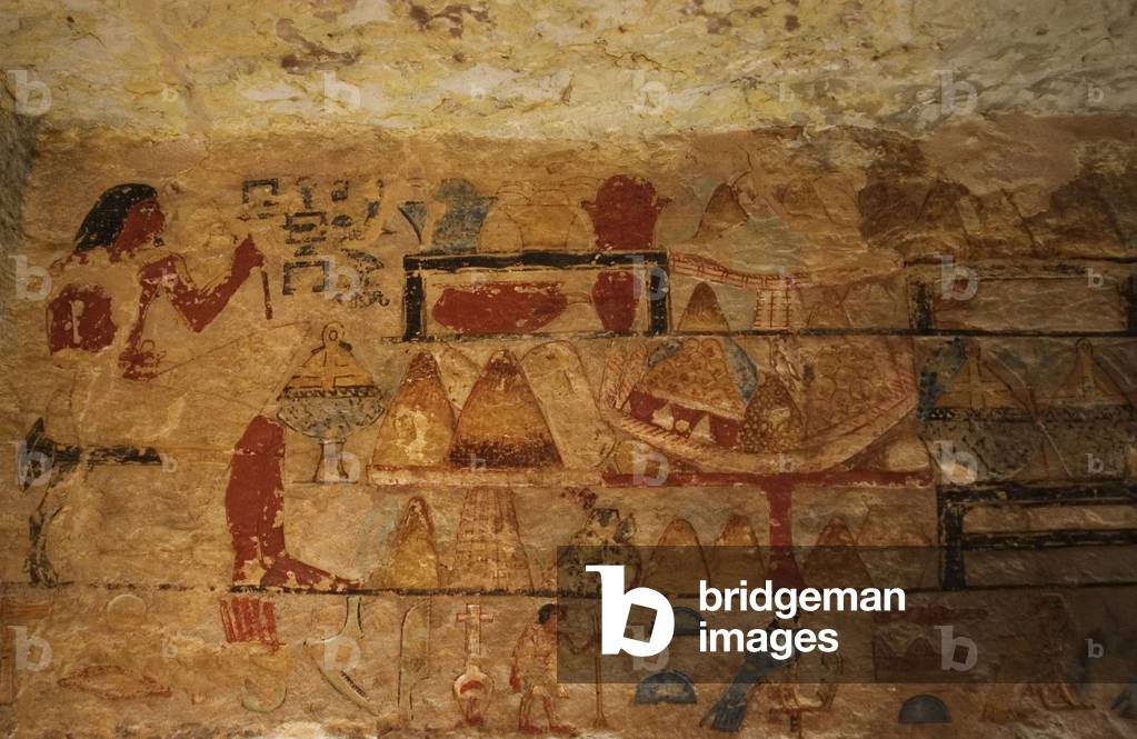 Egyptian Art. Deceased seated next to the offerings table. Relief. Mastaba. Necropolis of Saqqara. Egypt.