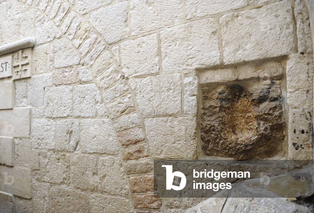 Israel. Jerusalem. Via Dolorosa. V Station. Stone with the print of hand of Jesus. 1st century.
