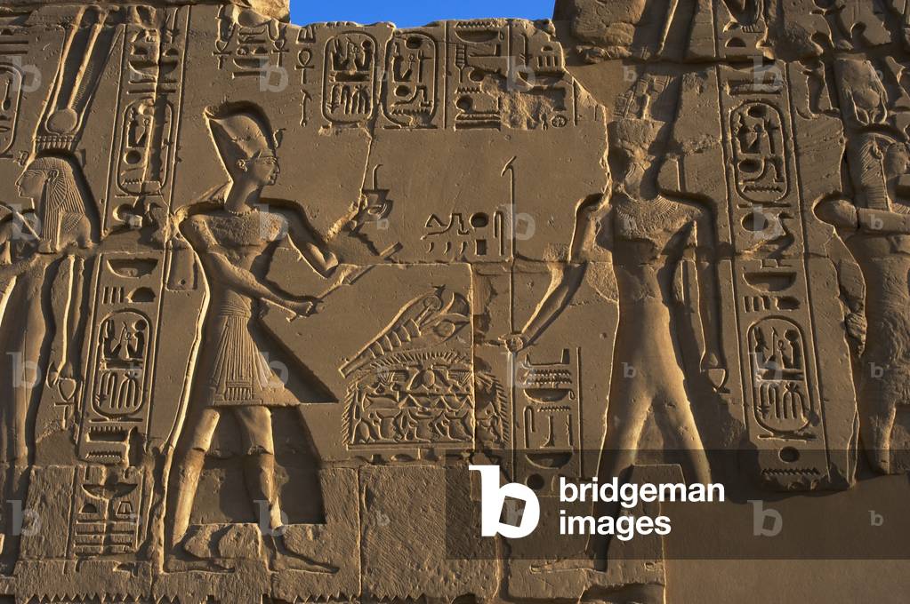 Egyptian Art. Karnak. The Pharaoh Ramesses II carrying an offering to the god Amun. Relief.