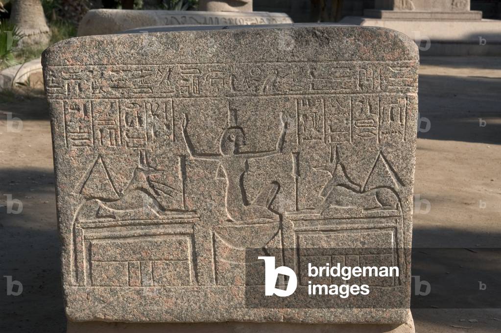 Goddess Nephthys between two figures of god Anubis, relief