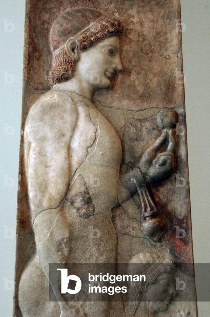 Greek art. Archaic era. Greece. Funerary stele. Marble. Young athlete with a grenade in his hand and an aryballos hung from his wrist. Beside him, a little girl. 