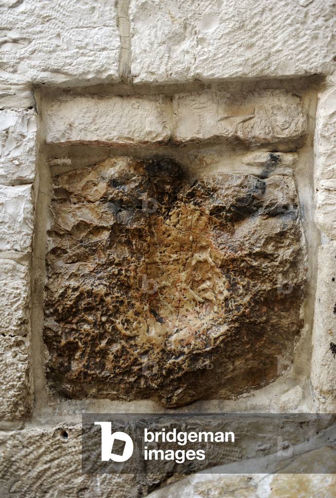 Israel. Jerusalem. Via Dolorosa. V Station. Stone with the print of hand of Jesus. 1st century.