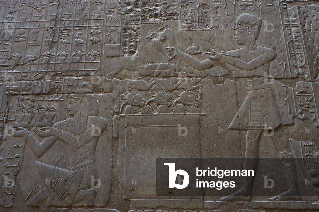 Relief depicting a religious offering.