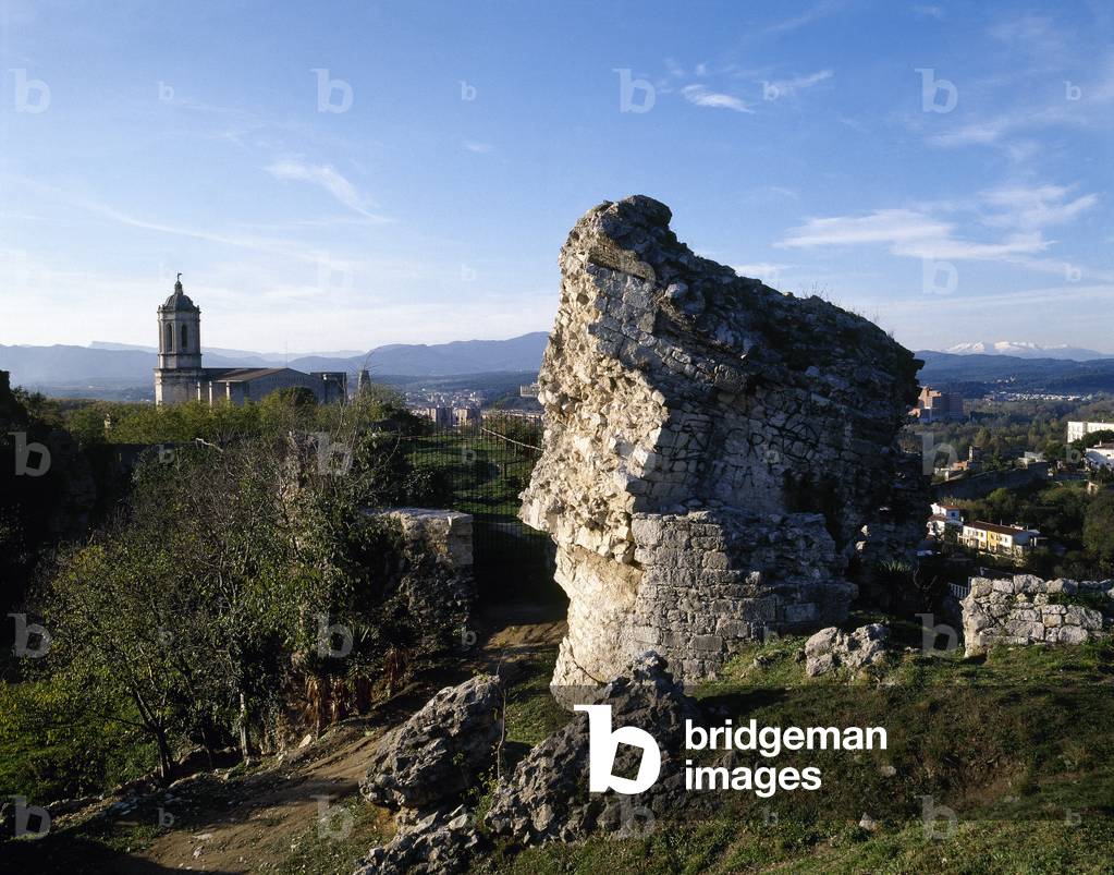 Spain. Girona. Medieval City Walls. Remains. Detail. At background, the Cathedral.