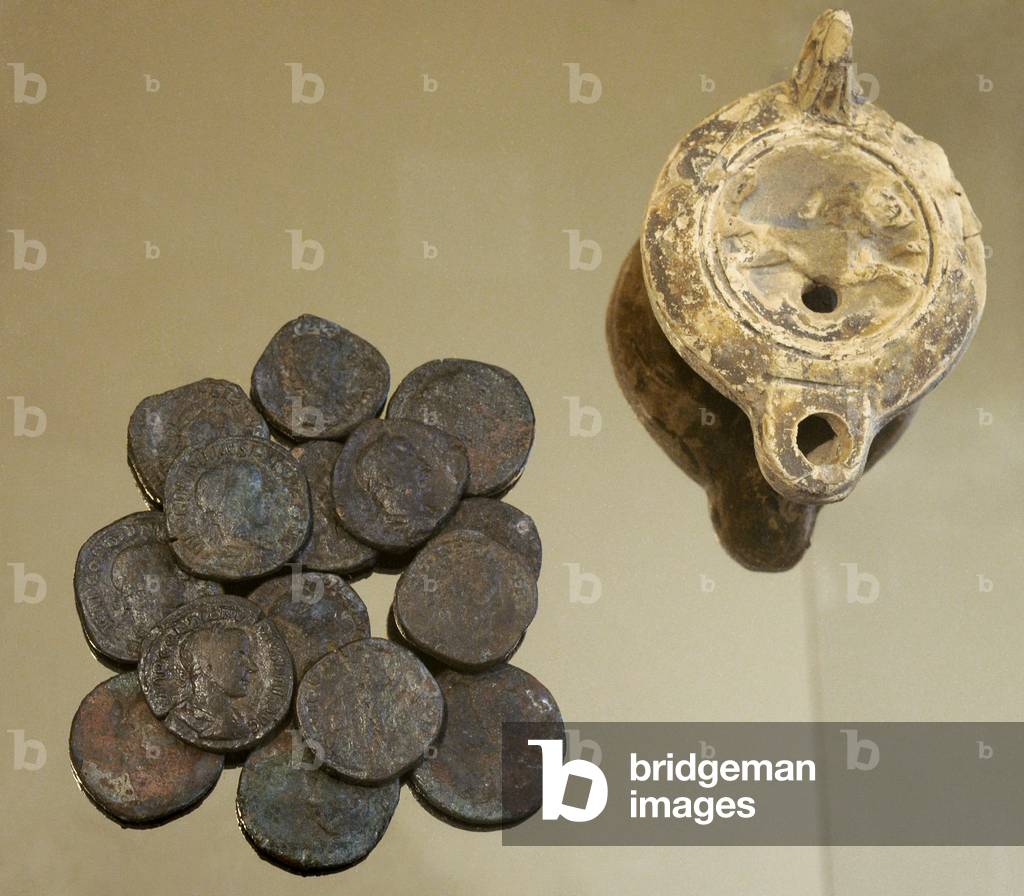 Lamp and set of coins that carried the person who died because of the fire of the villa, 2nd CE, Spain
