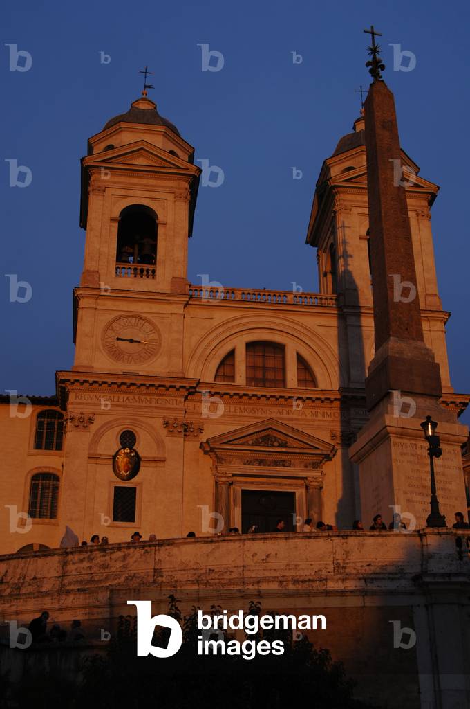 Church of the Trinita dei Monti and the Sallust Obelisk at sunset.