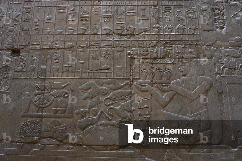 Relief depicting a religious offering.