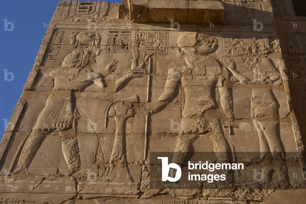 Temple of Ramses III. Relief depicting Ramses III making offerings before god Ra. Medinet-Habu. Egypt.