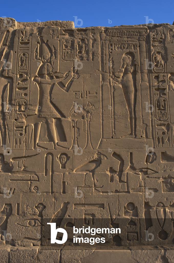Egyptian Art. Karnak. The Pharaoh Ramesses II making an offering to the god Ptah. Relief.