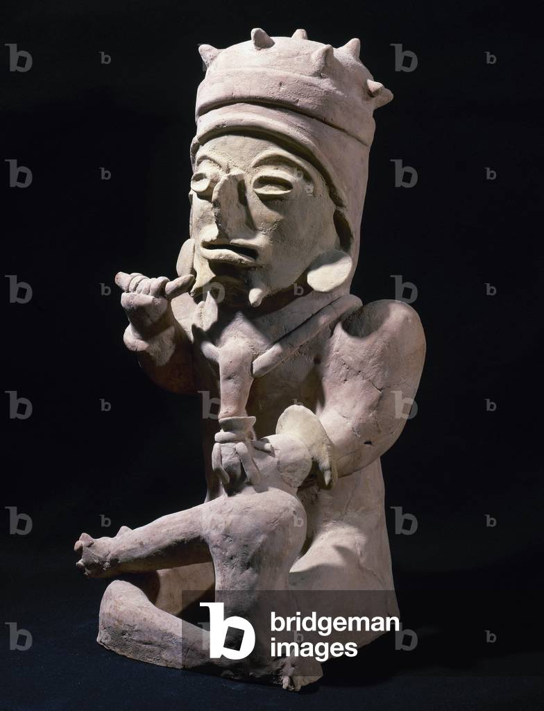 Bahia Culture (Mahia, Ecuador). Male figure sitting cross-legged and hands objects.  Period of Regional Development.