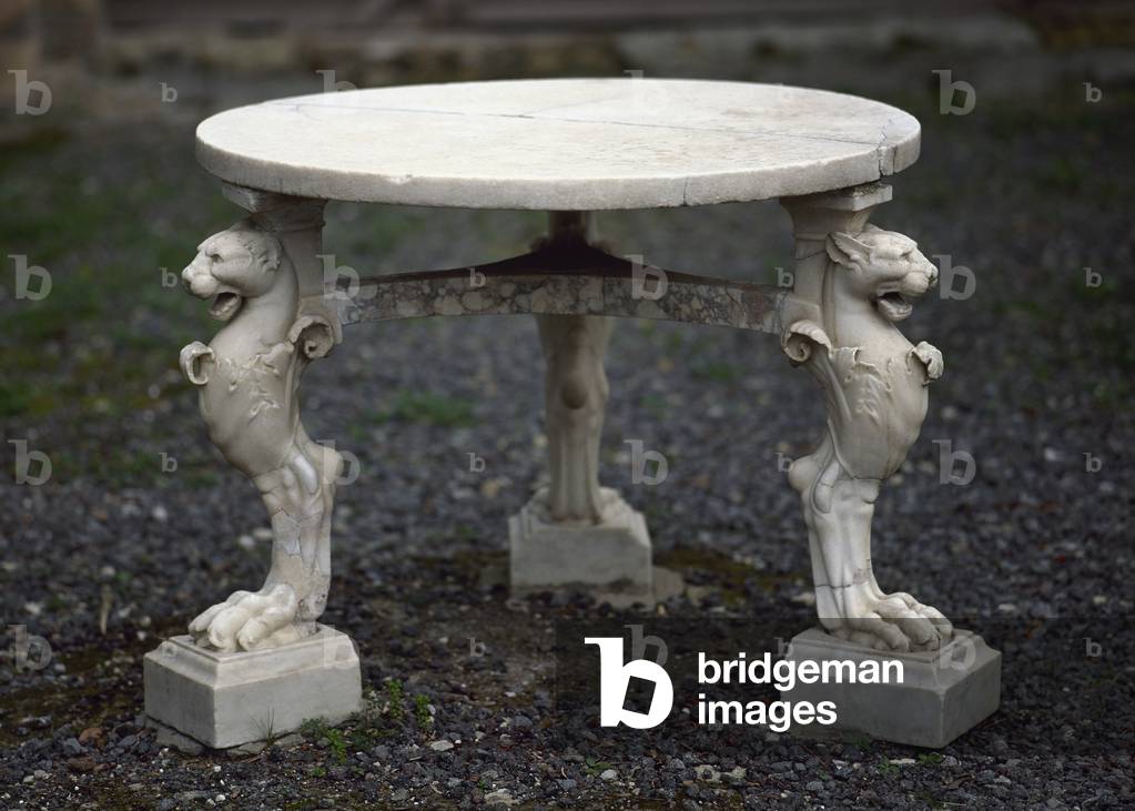 Italy. Herculaneum. The House of the Stags. 1st AD. Small table in the garden.