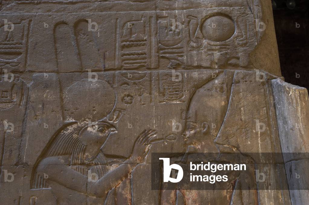 Relief depicting the god Monthu offering the ankh to the pharaoh.