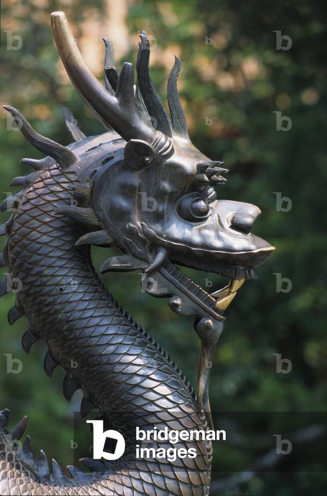 Bronze statue depicting a dragon. Forbidden quote from Pekin (Beijing), China.
