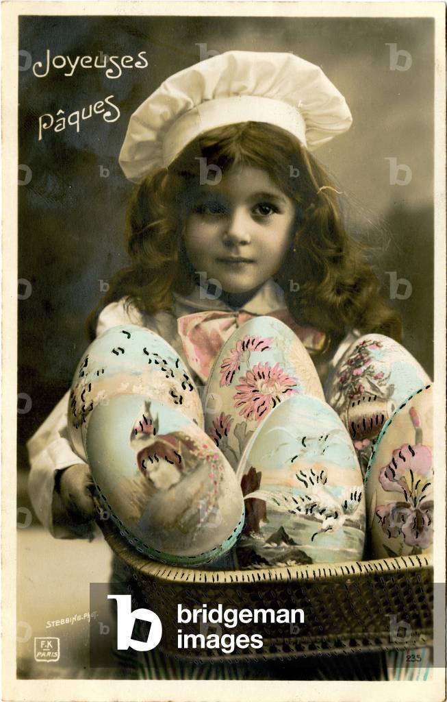 Postcard, Easter greetings: girl with a cook's hat and eggs in a basket. The beginning of the 20th century.