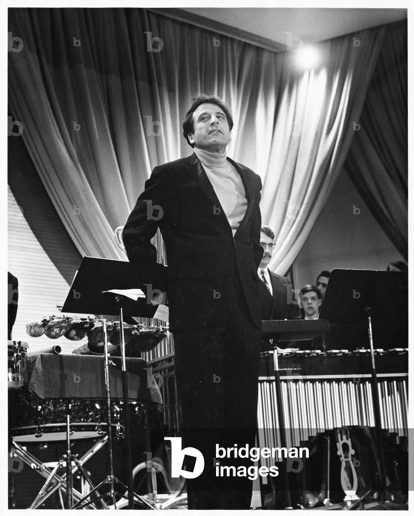 Lukas Foss, composer and conductor, standing on stage at Second Festival of the Arts, March 1968