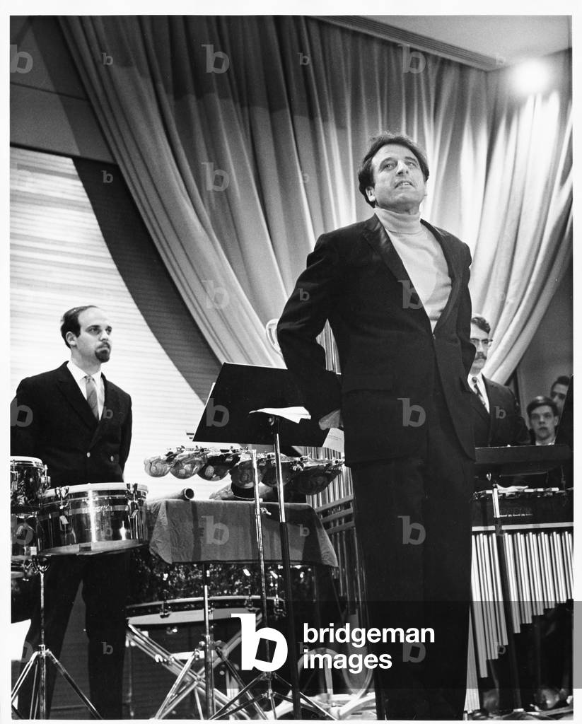 Lukas Foss, composer and conductor, standing on stage at Second Festival of the Arts, March 1968