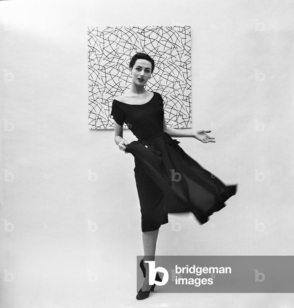 Model posing in front of a painting, Look Magazine, New York, c.1960s (b/w photo)