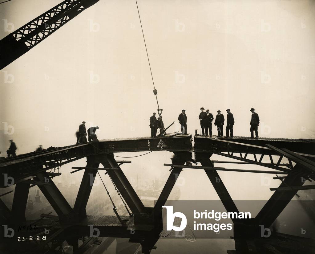 An historic moment as the Newcastle and Gateshead sides of the Tyne Bridge meet, 23rd February 1928 (b/w photo)