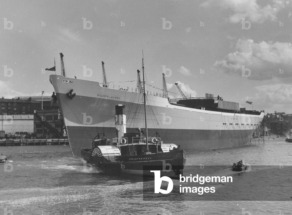 The cargo ship 'Silverlaurel' under tow on the River Wear after launch, Sunderland, Tyne and Wear, UK, 30 June 1950 (b/w photo)

