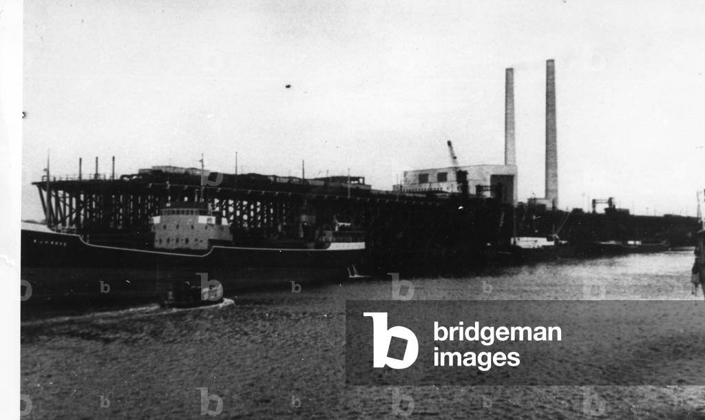 View of Blyth Harbour, showing a three island collier at Blyth Staiths with the power station in the background (b/w photo)