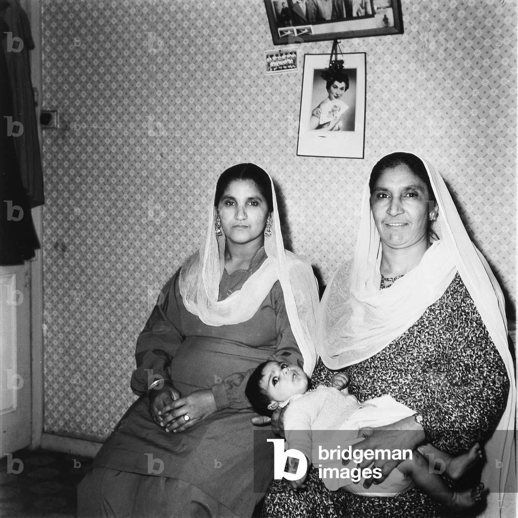 Two Sikh women with baby, Newcastle upon Tyne, 1958 (b/w photo)
