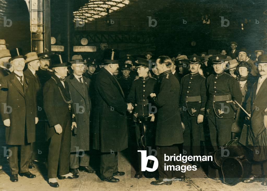 Greeting members of Marsden Colliery Band, Newcastle Central Station, Newcastle, UK, 1925 (b/w photo)