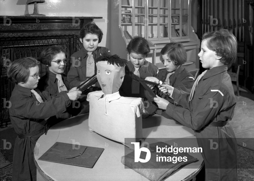 Members of the Royal Victoria School for the Blind Brownie pack working together, Newcastle upon Tyne, UK, January 1962 (b/w photo)

