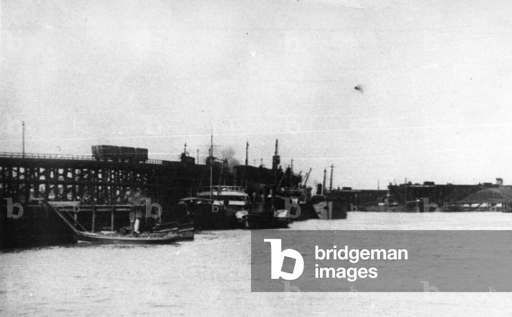 Blyth Harbour, showing an amount of colliers lying alongside Blyth Staiths with a Harbour Commission launch in the foreground (b/w photo)