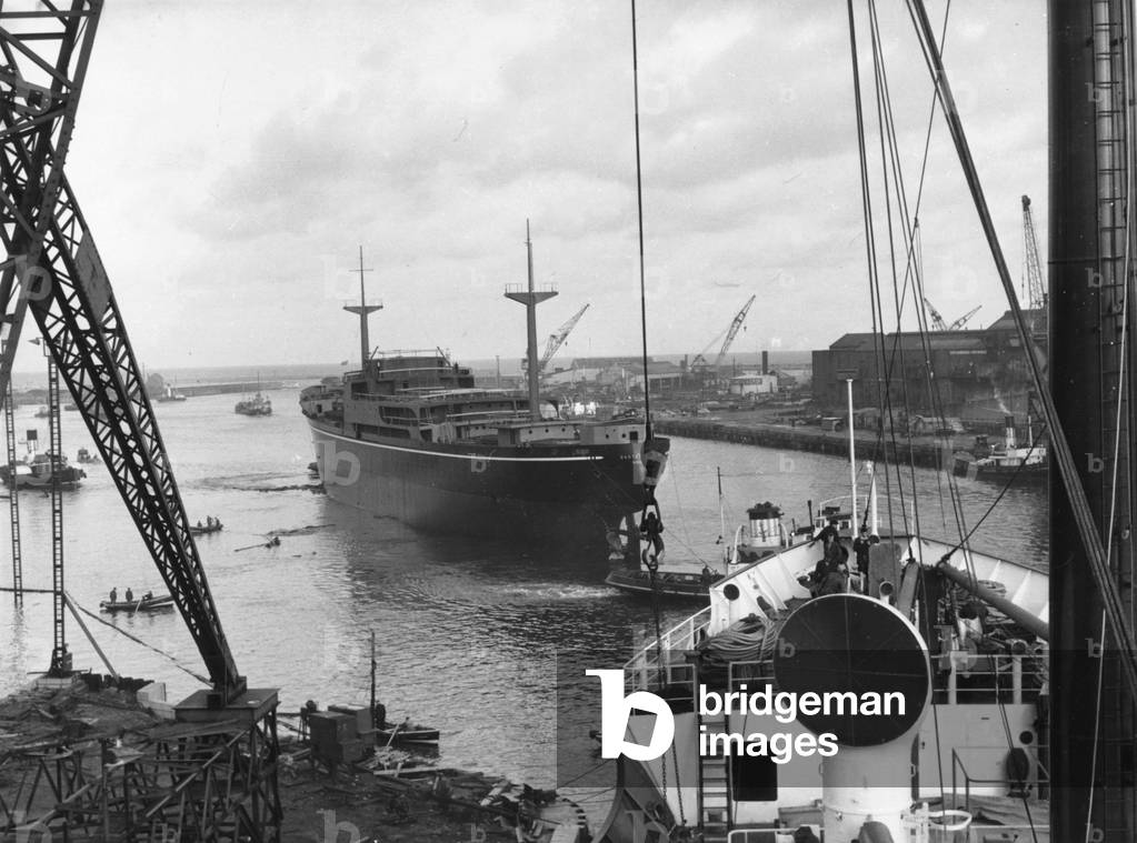 The cargo ship ‘Eastern Ranger’ after launch on the River Wear, Sunderland, Tyne and Wear, UK, 1961 (b/w photo)
