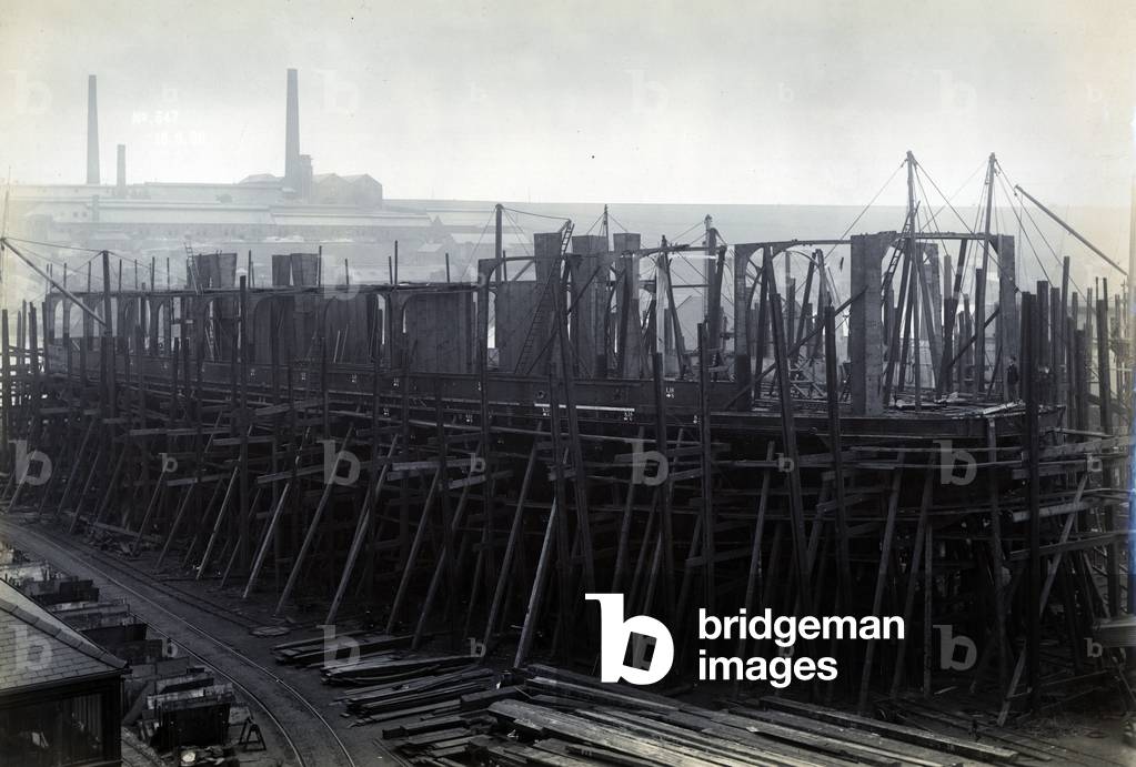 The ice-breaking train ferry steamer 'SS Baikal' in frame during construction by Sir W.G. Armstrong Mitchell and Co. Ltd., at Low Walker shipyard, Newcastle upon Tyne in 1896 (b/w photo)