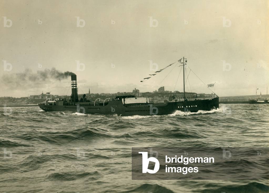 The cargo ship 'Sir David' leaving the River Tyne, 1927 (b/w photo)