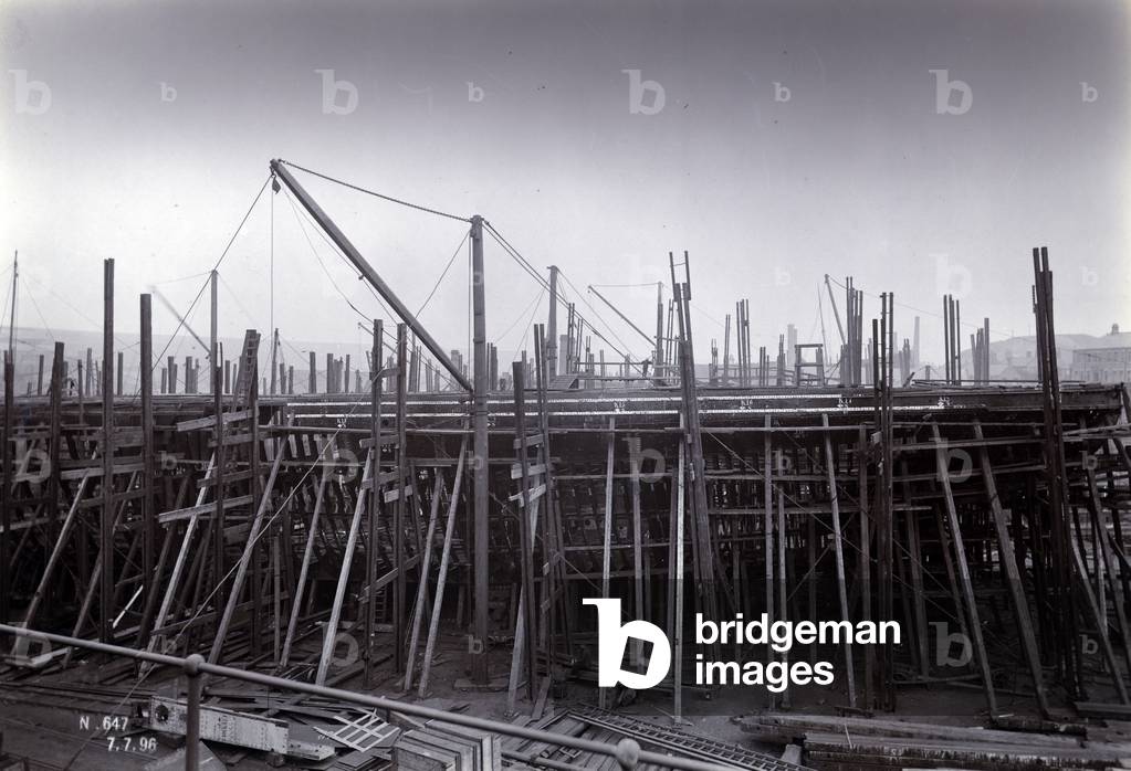 The ice-breaking train ferry steamer 'SS Baikal' in frame during construction by Sir W.G. Armstrong Mitchell and Co. Ltd., at Low Walker shipyard, Newcastle upon Tyne in 1896, Yard No. 647 (b/w photo)