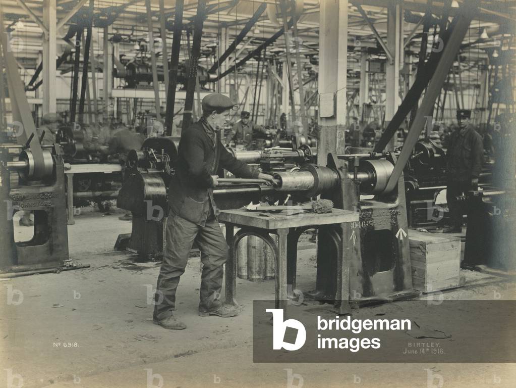 Polish the inside of the shell for inspection at the National Projectile Factory, Birtley, UK, 14 June 1916 (b/w photo)