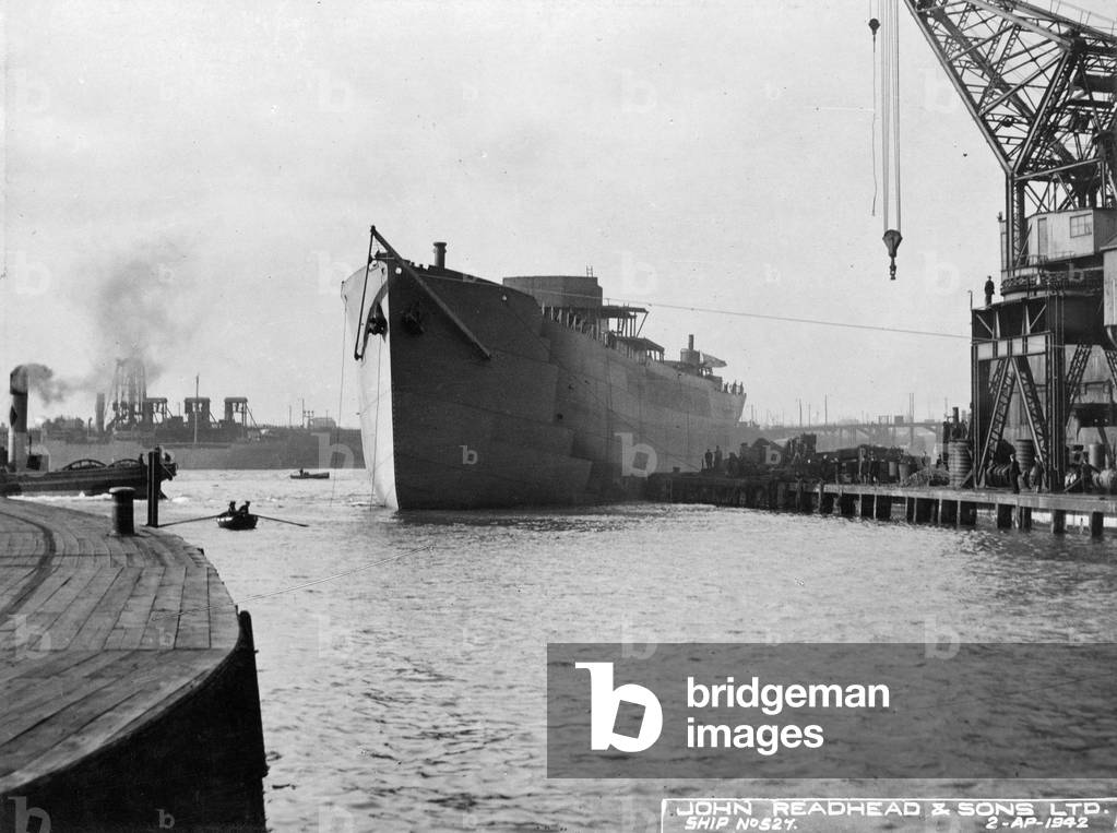 Towing 'Empire Clough' to the fitting out quay, South Shields, UK, 1942 (b/w photo)