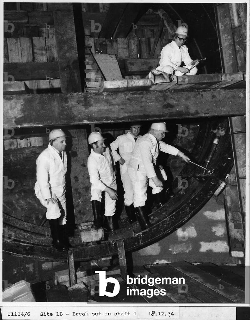 A group of men in a Metro shaft, Tyne & Wear, UK, 18th December 1974 (b/w photo)