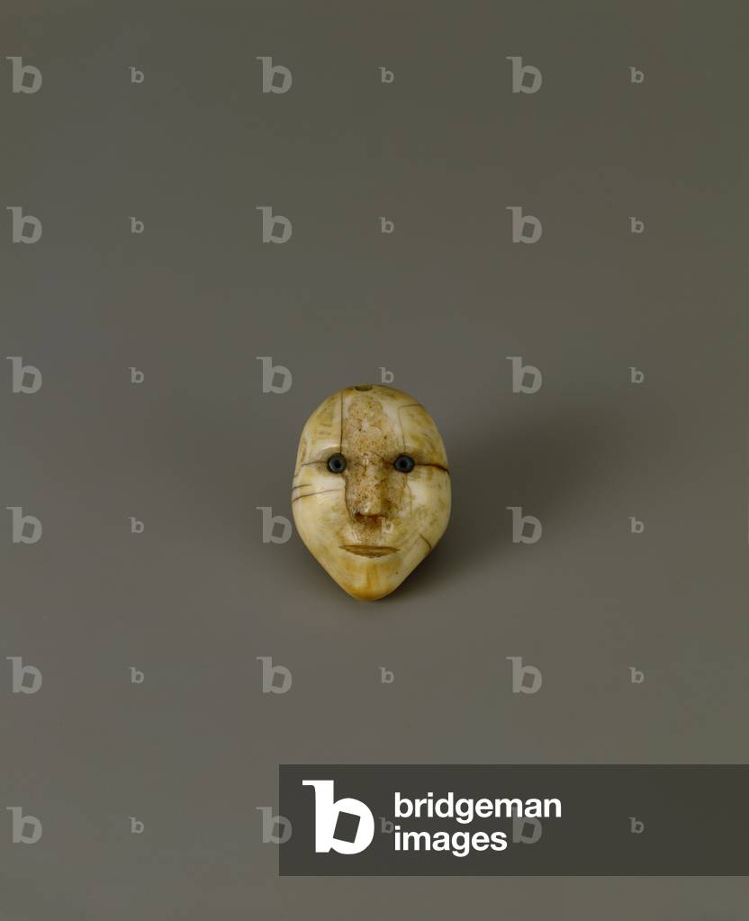 Head from a drum handle from Alaska (walrus ivory & beads)